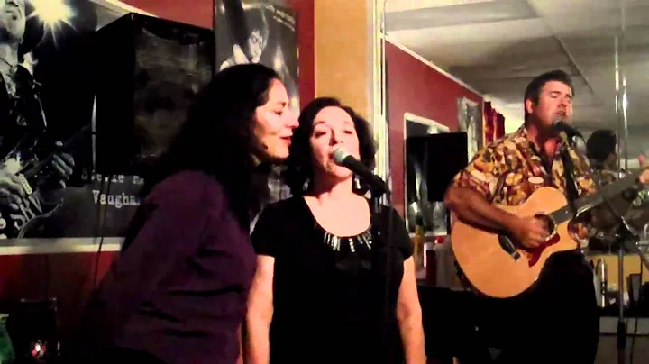 "Surround Me With Love", sung by John Atkinson, Ja...