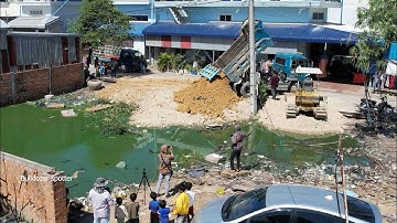 New!! landfill flooded in Villages by Dump truck unloading soil with operator bulldozer working push