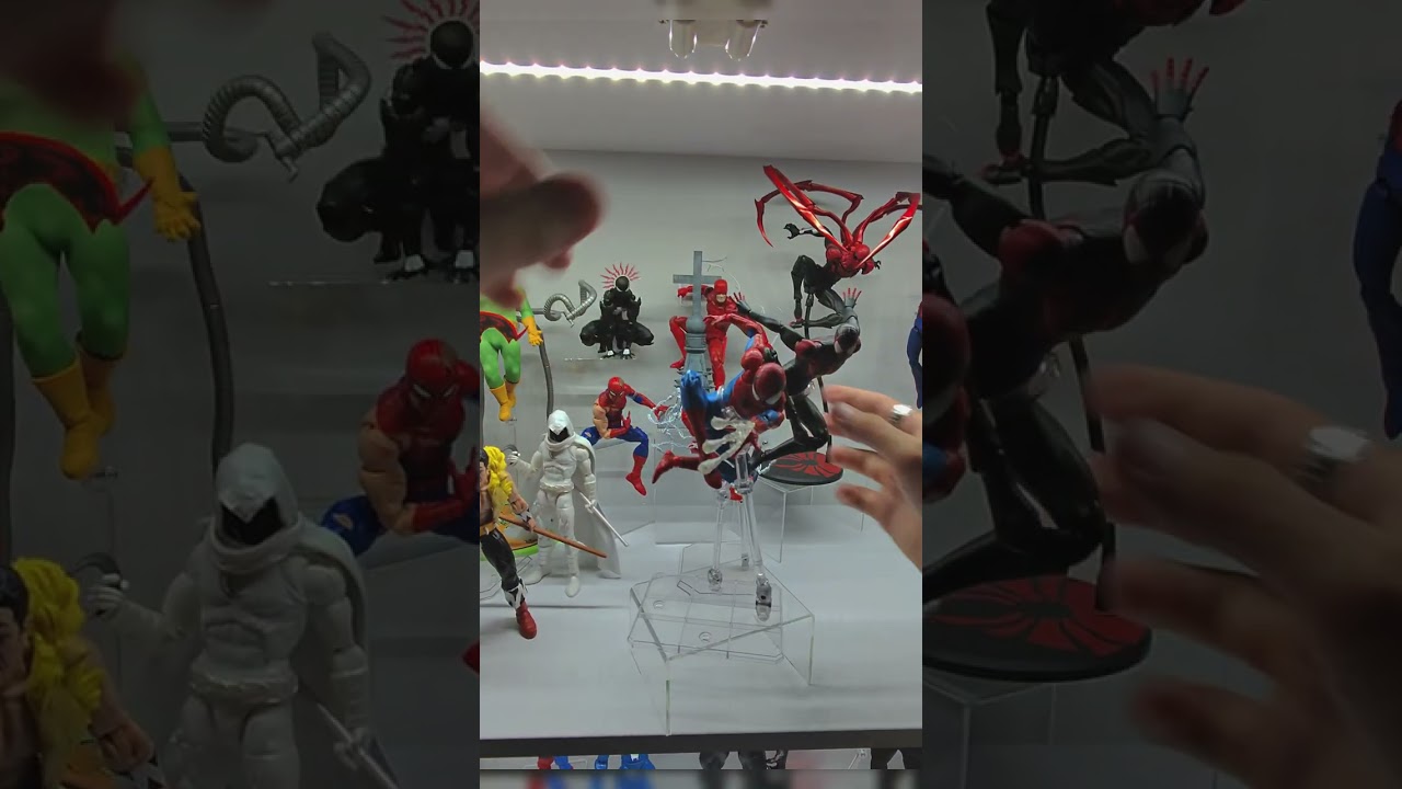 adding my new spidey figs to my display case !  