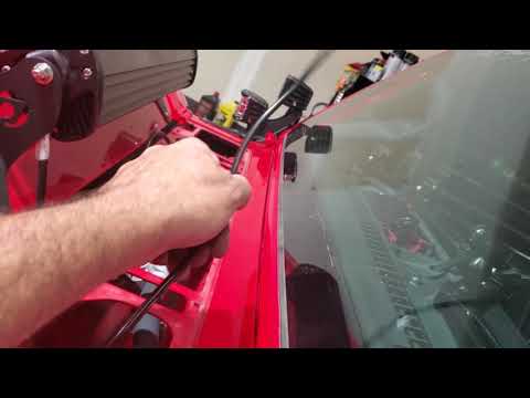 Relocating windshield wiper squirters