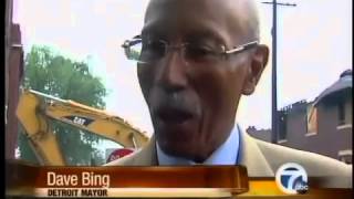 Demolition crews tear down Detroit buildings