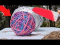 Glowing 1000 degree KNIFE VS Giant Rubber Band Ball