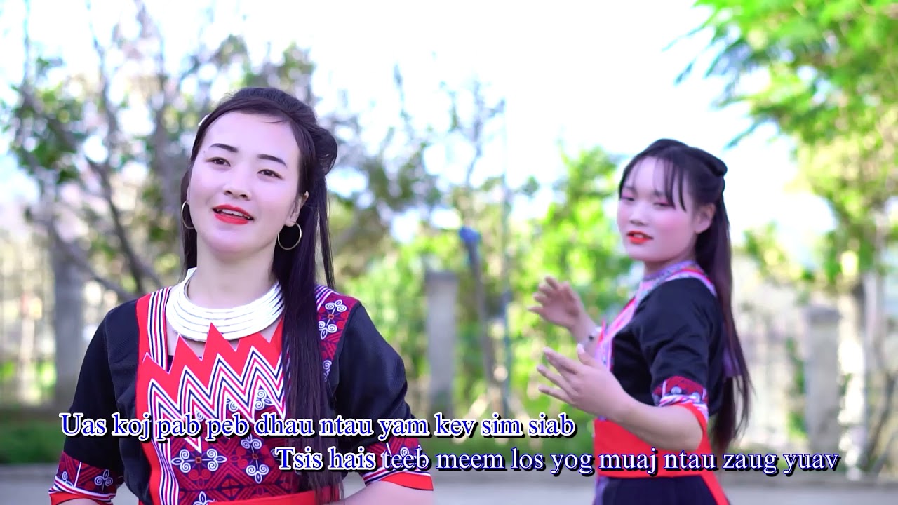 nkauj tawm tshiab-/ xyoo tshiab twb tis los txos/ niam txawj tswb