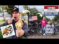 Americans try popular dutch street food for the first time in amsterdam