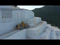 Komatsu And Caterpillar Wheel Loaders Working On Birros Marble Quarries - Aerial View