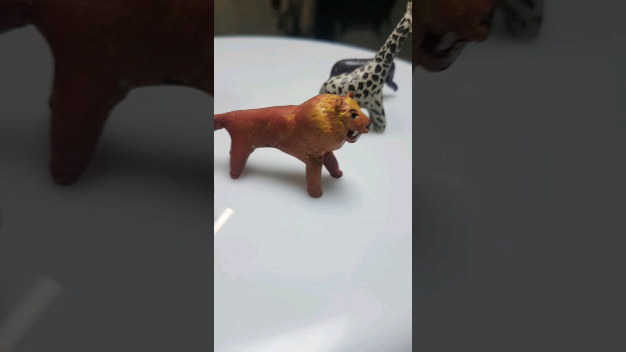 Clay animals figure lion , jiraf,bull, dinosaur, elephant,