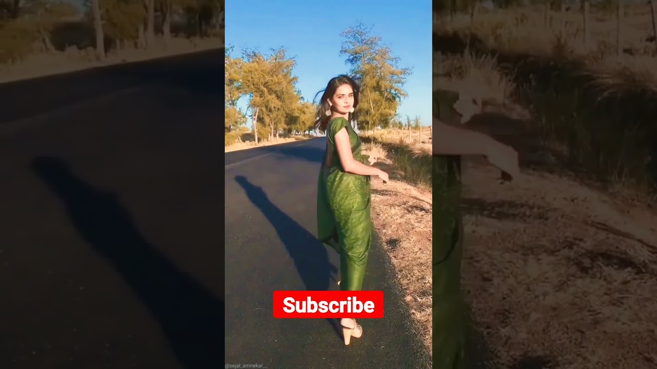 beautiful Sexy Woman Walking on Road in green saree 