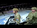 POV: Military member rappels from area rafters to deliver game puck