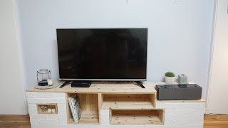 I made an entertainment center out of bricks and wood boards. It perfectly suits my tv and speaker. Thank you for watching! :D.