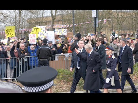 King Charles WAVES to anti-monarchy protesters on trip to Milton Keynes as town becomes a city