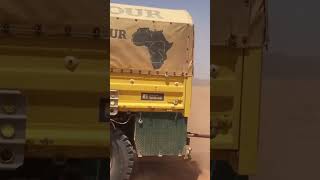 Driving Convoy Of Trucks In The Desert