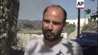 Rhodes residents react to wildfires