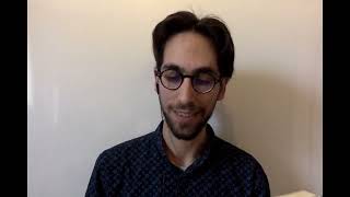 Aleks André legas poemon en esperanto de Julio Baghy