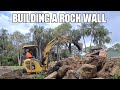 Building a Rock Retaining Wall with Excavator and Skid Steer