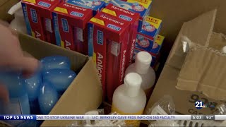United Way volunteers assemble hygiene kits for teens