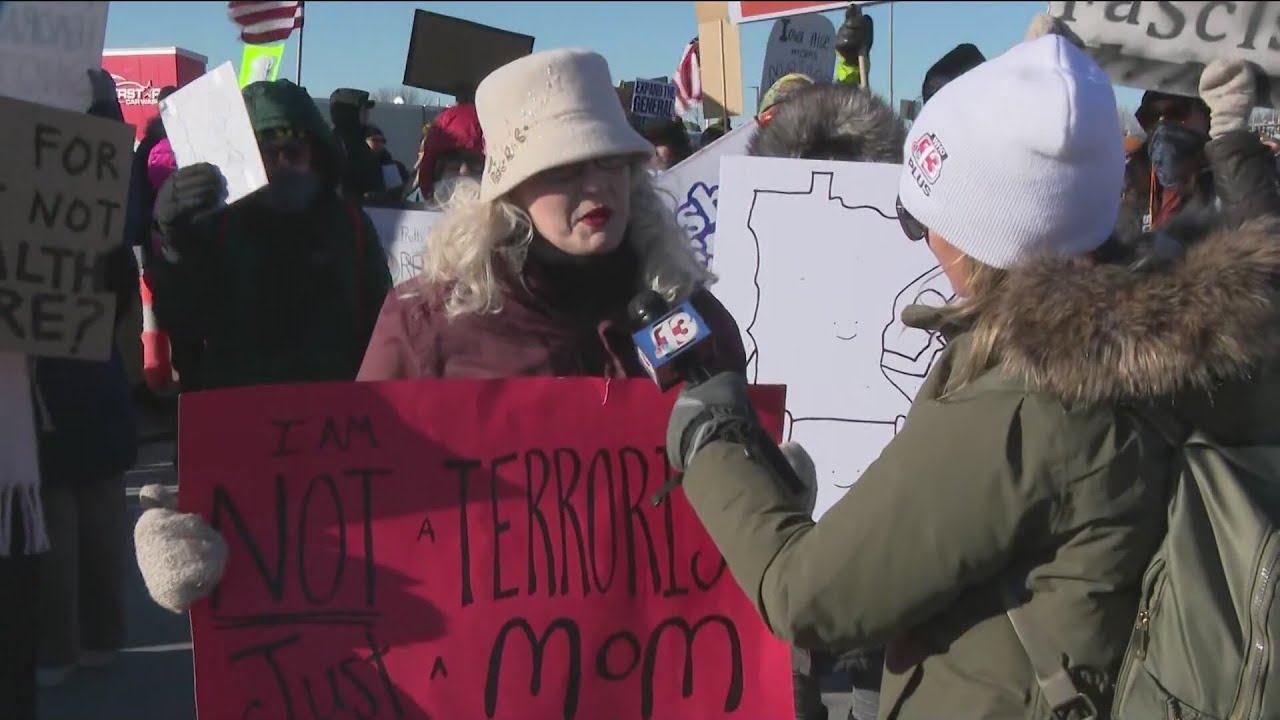 Large crowd of protesters gathered in Clive ahead of Presidential visit