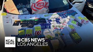 Deputies seize 800 allegedly stolen gift cards from two Chinese nationals