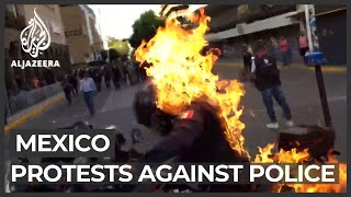 Mexico police set on fire during protests against fatal beating