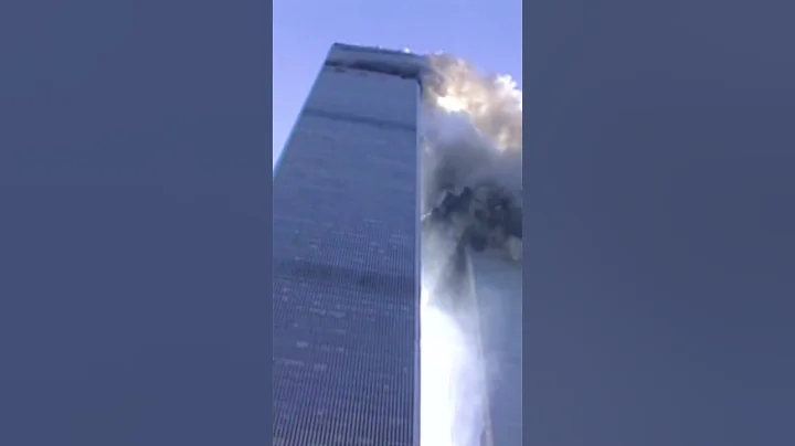 Reporter on camera as tower begins to collapse