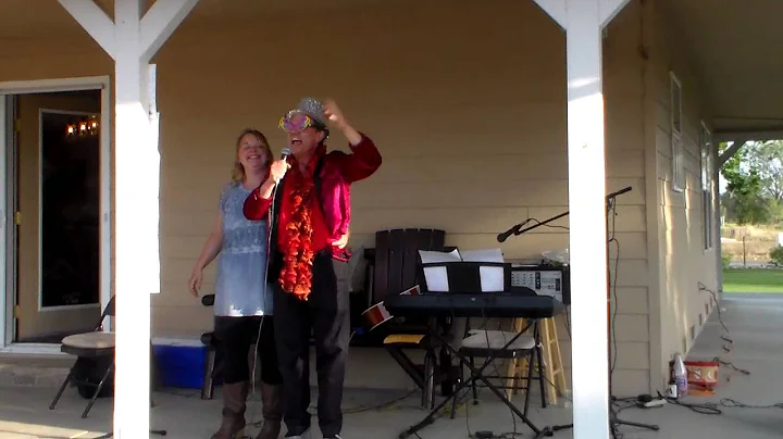 Patrick (Elton John) and Julie Slupski perform "Sp...