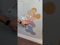 Dad turns kids scribble on wall into work of art 