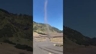 Man Witnessing a Small Tornado at Mount Bromo