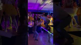 Person Falls to the Ground after Another Fails to Catch Him