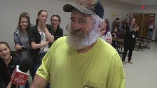 School custodian surprised with the gift of hearing from Secret Santa