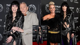 Cher, is rocker chic in bedazzled black bodysuit with sultry cut-outs as she joins Pink at premiere