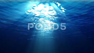 Underwater Scene With Sunrays Shining Through The Water's Surface