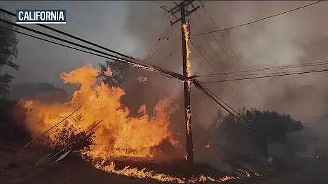 Crews battle deadly wildfires on both coasts of the United States