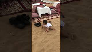 Playing with sand in Dubai dessert IMG 3360 #cutebaby #dubaidesserts