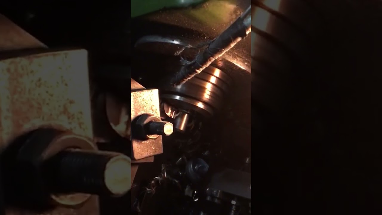 Retrofitting cnc lathe with part loader by Reco