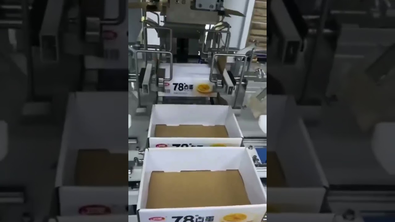 Automatic tray box forming machine.