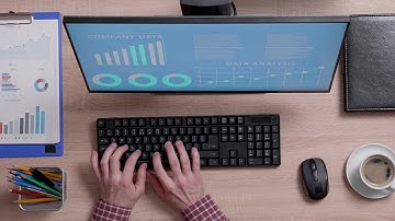 Man Typing On His Computer Stock Video