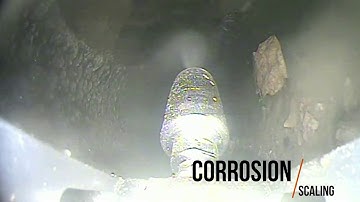 Solid pipe obstructions removal from sewer pipelines with water jet cutting