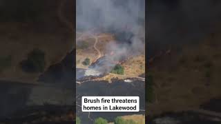 Lakewood homes threatened by brush fire Lakewood homes threatened by brush fire