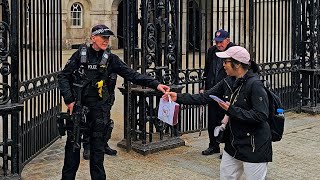 POLICE OFFICER SHUTS DOWN CHINESE TOURIST who tries to leave her litter at Horse Guards!