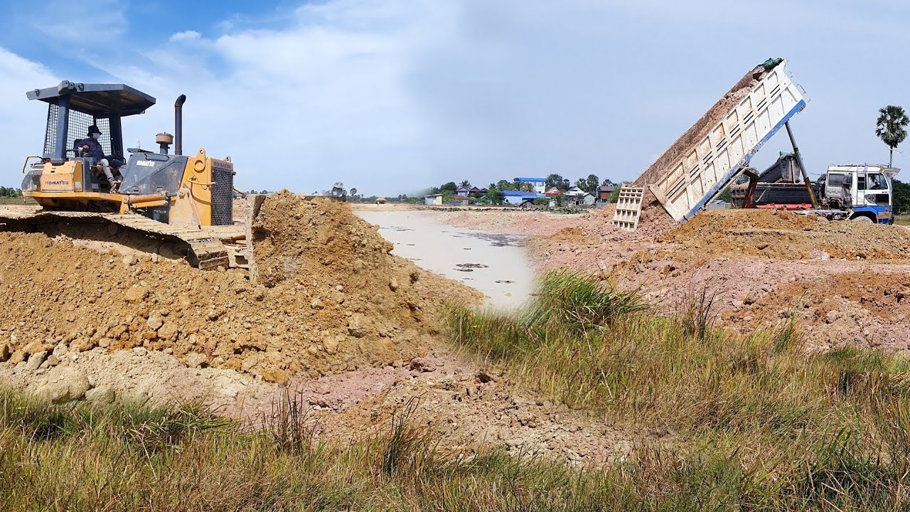 Great Filling up land Processing Dump Truck Unloading Soil & Dozer KOMATSU D61PX Push to clear land