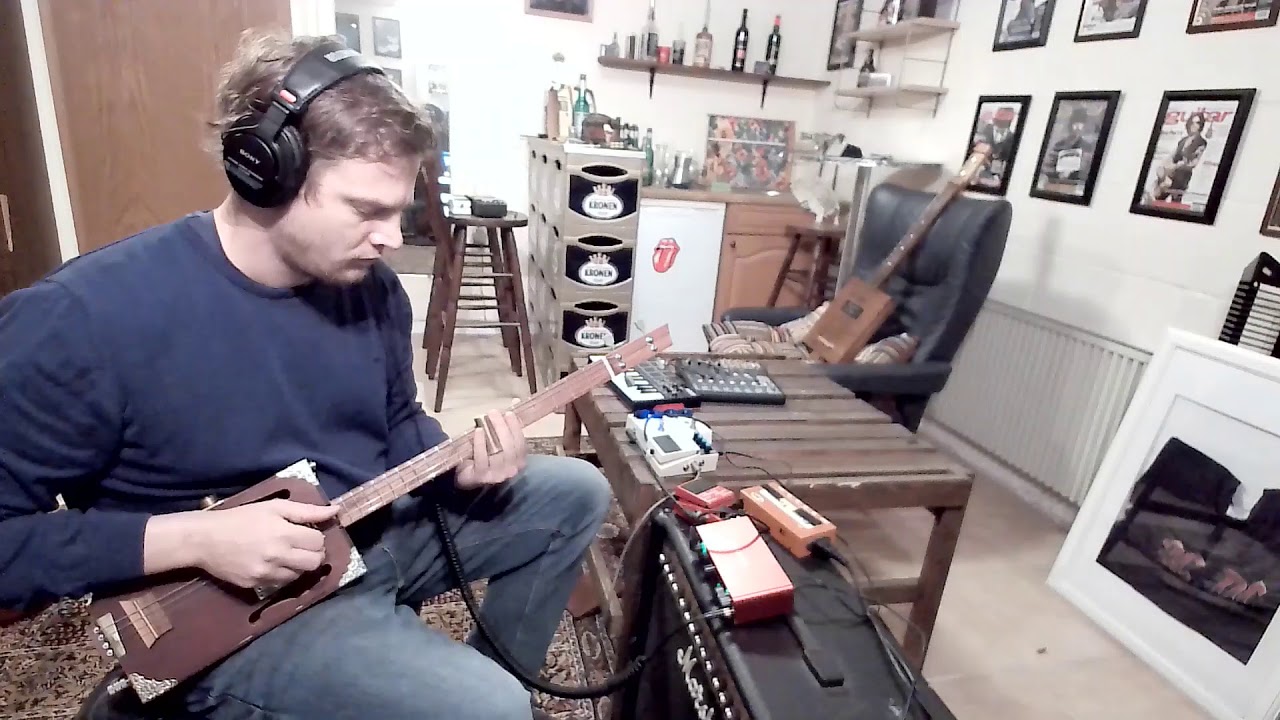 rocking blues cigar box guitar slide solo YouTube