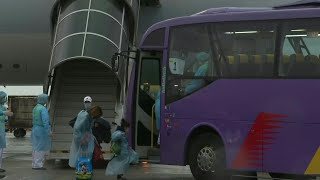 First batch of Hong Kongers repatriated from Hubei arrive home | AFP