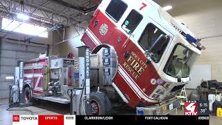 Under the fire engine with Sioux City Fire Rescue’s only mechanic