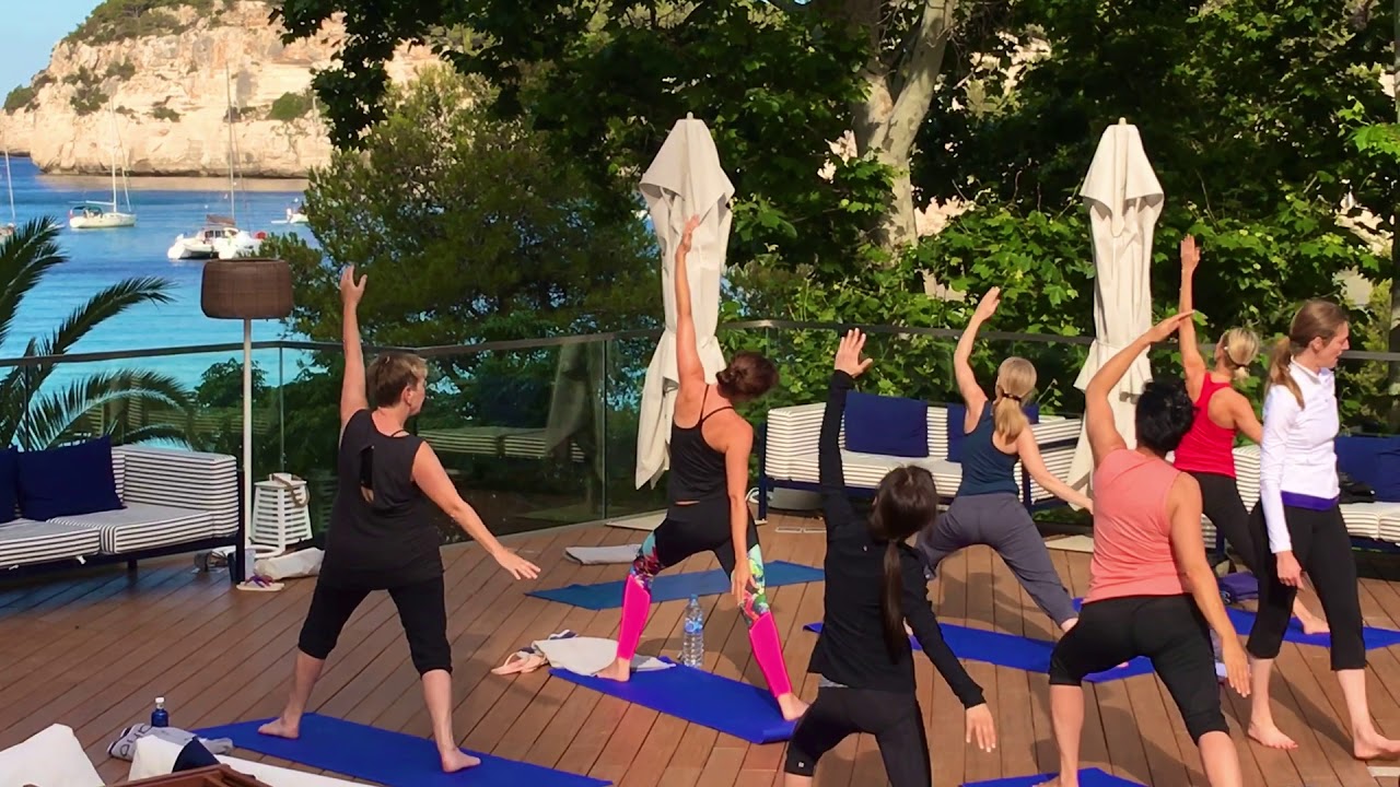 Vinyasa yoga class in Menorca Spain on a luxury yoga retreat.