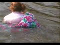 Woman swimming in her skirt