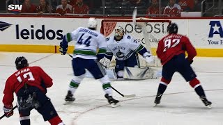 Gudbranson, Kuznetsov simultaneously knock puck in off Markstrom