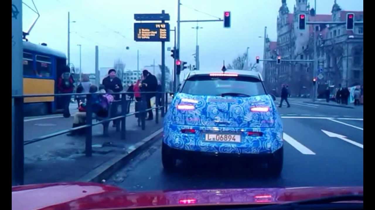 development mule caught in traffic ( can't tell if BMW i3 or Audi A2 hybrid)