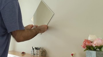 How to remove hard to reach double-sided tape from the wall without damage