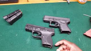 Glock 26 Gen 3 9mm VERSUS Smith and Wesson M&P 2 0 Subcompact 9mm - Tabletop Comparison