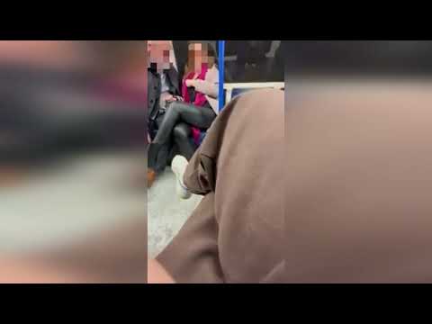 Shocking moment raunchy commuters are filmed getting up close and personal on London train