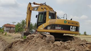 Excavator Cat 320 C-U Working for Canal Water System Outside the village Part 01